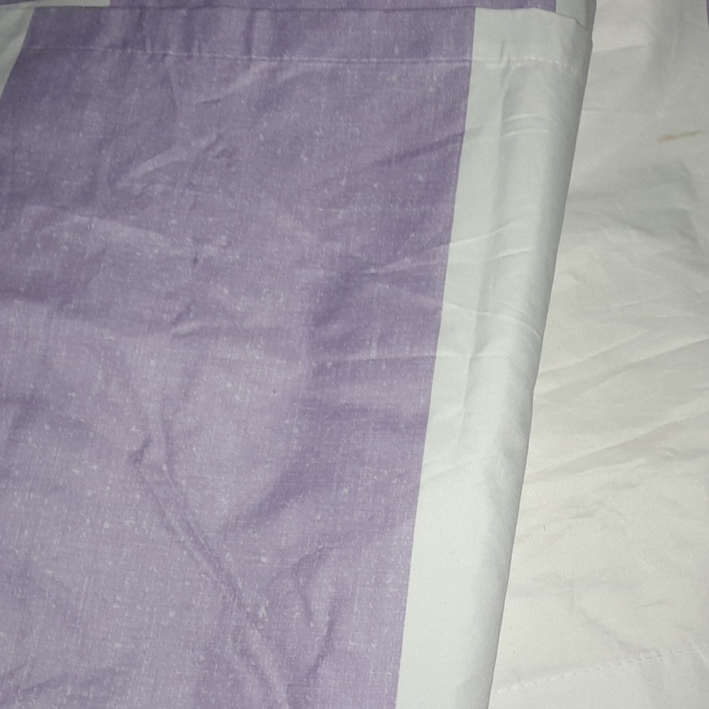 Purple and white black out curtins.